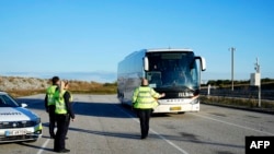 FILE - Copenhagen police stop a bus during a patrol at the border with Sweden on October 5, 2024. The Swedish intelligence agency Sapo said on October 3 that Iran may have been involved in explosions and gunfire around Israeli embassies in Sweden and Denmark.