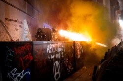 Federal agents use crowd control munitions to disperse Black Lives Matter protesters at the Mark O. Hatfield United States Courthouse in Portland, Oregon, July 19, 2020.