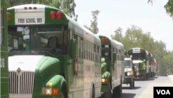 Buses transporting Nigerian returnees are seen in Maroua, northern Cameroon, March 8, 2021. (Moki Edwin Kindzeka/VOA)