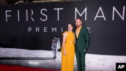 FILE - Claire Foy and Ryan Gosling attend the "First Man" premiere at the National Air and Space Museum of the Smithsonian Institution, Oct. 4, 2018.