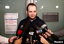 Joshua Boyle speaks to reporters after arriving with his wife and three children at Toronto Pearson International Airport, nearly five years after he and his wife were abducted in Afghanistan in 2012 by the Taliban-allied Haqqani network, in Toronto, Ontario, Oct. 13, 2017.