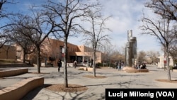 Students walk across the University of New Mexico campus in Albuquerque, New Mexico.