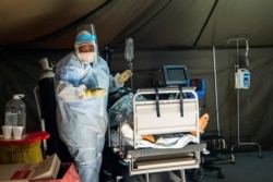 FILE - COVID-19 patients are being treated at the Tshwane District Hospital in Pretoria, South Africa, July 10, 2020.
