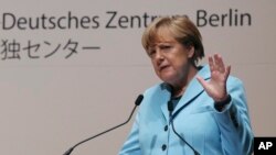 Kanselir Jerman Angela Merkel berbicara dalam kuliah di kantor pusat Asahi Shimbun di Tokyo (9/3). (AP/Koji Sasahara, Pool)