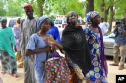 Chibok schoolgirls who escaped the rebels prepare to meet with officials in Maiduguri, Nigeria, June 2, 2014.