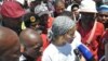Striking workers surround Liv Shange, a leader of South Africa's Workers and Socialist Party at a protest near Johannesburg. (Courtesy WASP)