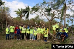 Abdulrauf Khan, center, a Pakistani immigrant, is the assistant executive director of ICNA Relief USA. He and his team pose for a group photo, in Cooper City, Florida.