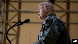 President Donald Trump speaks at a hanger rally at Al Asad Air Base, Iraq, Dec. 26, 2018.