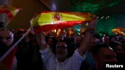 Supporters of Spain's far-right VOX party celebrate results after Andalusian regional elections in Seville, Spain, Dec. 2, 2018. 