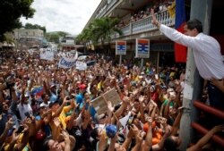 FILE - Venezuelan opposition leader Juan Guaido, who many nations have recognized as the country's rightful interim ruler, greets supporters during a gathering in Charallave, Venezuela, June 8, 2019.
