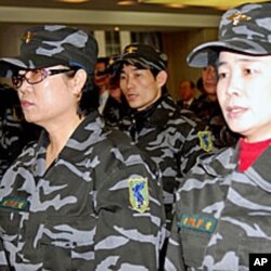 Members of the North Korea Peoples Liberation Front at a briefing in Seoul