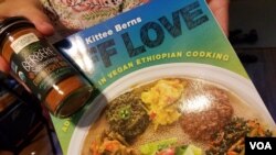 A vegan cookbook with recipes from the Ralbovsky’s foster son’s current country is a hopeful nod to the couple’s plans for activities that blend their lives with the teenager’s. Greenbelt, Maryland, July 11, 2017. (A. Arabasadi/VOA)