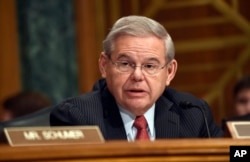 FILE - Sen. Robert Menendez, D-N.J. addresses fellow members of the Senate Banking Committee in Washington, Jan. 27, 2015.