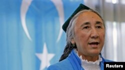 Uighur leader Rebiya Kadeer delivers a speech in front of a East Turkestan flag at the fourth General Assembly of the World Uighur Congress in Tokyo, May 14, 2012.