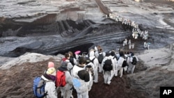 Supporters of the climate movement Ende Gelaende protest at the coal-fired power station Lippendorf near Leipzig, Germany, Nov. 24, 2019.