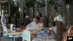 Patients are connected to oxygen tanks at the Afghan-Japan Communicable Disease Hospital, for COVID-19 patients in Kabul, Afghanistan, June 18, 2020.