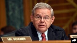 Sen. Robert Menendez, D-N.J. addresses fellow members of the Senate Banking Committee in Washington, Jan. 27, 2015.