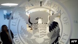 FILE - The Department of Homeland Security logo is seen at one of its annex facilities in Fairfax, Va., July 22, 2015.