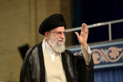 FILE - Iran's Supreme Leader Ayatollah Ali Khamenei waves during ceremony attended by Iranian clerics in Tehran, July 16, 2019.
