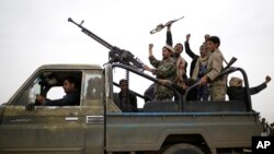 Houthi rebels fighters chant slogans following a gathering aimed at mobilizing more fighters in Sana’a, Yemen, Aug. 1, 2019. 