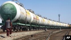 In this Tuesday, March 6, 2012 photo, a cargo train at the train station in Mazar-i-Sharif, Balkh province, part of Afghanistan's first major railroad, north of Kabul.