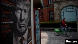 A Chinese magazine poster showing U.S. President Donald Trump is displayed at a newsstand in Shanghai, China March 21, 2017. 