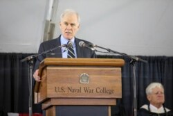 FILE - Secretary of the Navy Richard Spencer addresses graduates during the U.S. Naval War College's commencement ceremony, in Newport, Rhode Island, June 14, 2019.