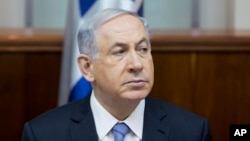 FILE - Israeli Prime Minister Benjamin Netanyahu attends a weekly cabinet meeting in Jerusalem, Jan. 4, 2015. Netanyahu is headed to Washington to give a controversial address to the U.S. Congress.