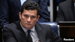 FILE - Brazilian federal judge Sergio Moro reacts during a session at the Federal Senate in Brasilia, Brazil, Dec. 1, 2016.