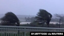 Trees blow in strong winds as Hurricane Isaias hits the Bahamas on July 31, 2020 in this still image taken from social media video, filmed from the Grand Isle Resort and Spa at Emerald Bay, Great Exuma.
