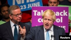 Former London Mayor Boris Johnson speaks as Michael Gove listens at a Vote Leave rally in London, Britain, June 19, 2016. 