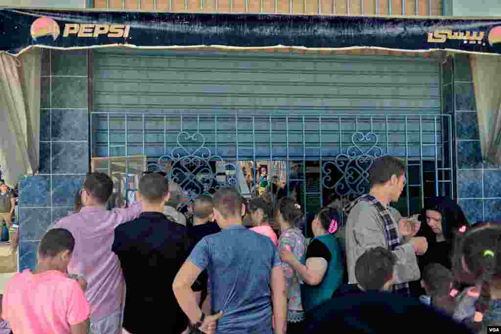  Pilgrims to Virgin Mary Monastery buy soda and mineral water to beat the extreme heat of Egypt&#39;s summer days. Sunday, August 18, 2019. 