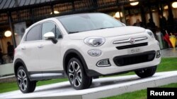 FILE - The FIAT 500x model is seen during the official presentation in Balocco, northern Italy, Nov. 11, 2014. German environmental lobby group DUH accusing Fiat Chrysler Automobiles' 500X compact sport-utility vehicle of releasing excessive levels of toxic diesel emissions.