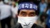 FILE - A Seoungju resident takes part in a protest against the government's decision on deploying a U.S. THAAD anti-missile defense unit in Seongju, in Seoul, South Korea, July 21, 2016. 