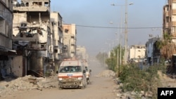 TOPSHOT - Ambulances transport wounded Palestinians from the Kamal Adwan Hospital to the Al-Shifa hospital in Gaza City, on December 28, 2024, amid the ongoing war between Israel and the Hamas militant group.