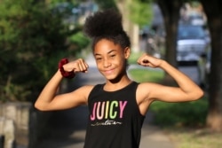 Rising 5th Grader Riley Cooper is a fixture at Thamar Davis's personal training business. (Saqib Ul Islam/VOA)