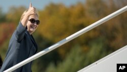 Democratic presidential candidate Hillary Clinton boards her campaign plane at Westchester County Airport in White Plains, N.Y., Oct. 18, 2016, to travel to Las Vegas for the third presidential debate.
