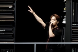 In this Jan. 14, 2019, file photo, singer Hong Kong singer Jackson Wang performs at the end of the Fendi men's Fall-Winter 2019-20 collection, that was presented in Milan, Italy.