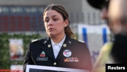 Air Force veteran Josephine Guilbeau attends a vigil for late U.S. Airman Aaron Bushnell at the Israeli Embassy in Washington, Feb. 26, 2024.