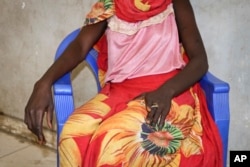 In this photo taken Dec. 7, 2018, an 18-year-old woman recounts the day in early November when she and a friend were bound, dragged into the bush and raped by four men with guns, as she sits in a hospital in Nhialdu, South Sudan.
