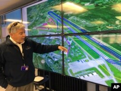 Tony Basile of the Northeast UAS Airspace Integration Research Alliance based at Griffiss International Airport in Rome, N.Y., describes drone test flight paths, Oct. 17, 2017.