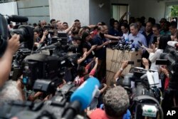 The president of the Flamengo soccer club, Rodrigo Landim, talks to the press after a deadly fire at the soccer club in Rio de Janeiro, Brazil, Friday, Feb. 8, 2019. The fire tore through the sleeping quarters of the club's academy.