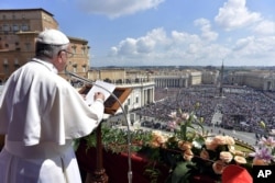 Pope Francis delivers his Urbi et Orbi (to the city and to the world) message from the main balcony of St. Peter's Basilica, at the Vatican, April 16, 2017.