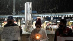 Advocates and migrants demonstrate at San Ysidro crossing port during a vigil named "Path towards Humane Immigration Reform", in Tijuana, Baja California state, Mexico on January 19, 2021, ahead of the 59th inaugural ceremony for President-elect Joe Biden