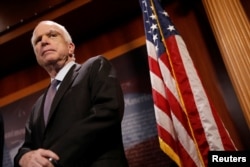FILE - Senator John McCain looks on during a press conference on Capitol Hill in Washington, U.S., July 27, 2017.