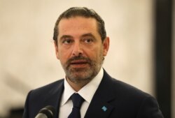 FILE - Former Lebanese Prime Minister Saad Hariri speaks at the presidential palace in Baabda, Lebanon, Aug. 31, 2020.