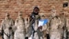 FILE - Boko Haram leader Abubakar Shekau speaks in front of guards at an unknown location in Nigeria in this still image taken from an undated video obtained Jan. 15, 2018. 