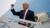 FILE - President Donald Trump gestures as he arrives at Springfield-Branson National Airport before attending a campaign rally in Springfield, Missouri, Sept. 21, 2018.