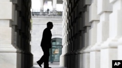 FILE - Senate Majority Leader Mitch McConnell of Ky. arrives at the U.S. Capitol in Washington. 