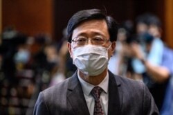 Hong Kong Secretary for Security John Lee leaves after speaking to the press in Hong Kong on May 27, 2021.